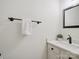 Modern bathroom with a marble countertop, stylish fixtures and decorative plant at 1140 Iverleigh Trl, Charlotte, NC 28270