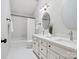 Well-lit bathroom with double vanity, sleek mirrors, and a shower-tub combination at 1140 Iverleigh Trl, Charlotte, NC 28270