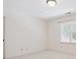 Minimalist bedroom with a neutral carpet, a window and a door at 1140 Iverleigh Trl, Charlotte, NC 28270
