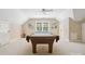 Spacious game room with a pool table, fan and vaulted ceiling at 1140 Iverleigh Trl, Charlotte, NC 28270