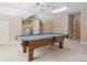 Cozy game room with pool table, fan, and ample lighting perfect for entertaining at 1140 Iverleigh Trl, Charlotte, NC 28270