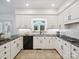 The kitchen is complete with stainless appliances and granite counters at 1140 Iverleigh Trl, Charlotte, NC 28270