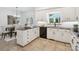 Kitchen boasts granite counters, white cabinetry, and updated appliances near a dining area at 1140 Iverleigh Trl, Charlotte, NC 28270