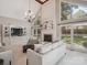 Bright living room with high ceilings, fireplace, built-in storage and ample natural light at 1140 Iverleigh Trl, Charlotte, NC 28270