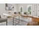Bright home office featuring a modern desk and large windows at 1140 Iverleigh Trl, Charlotte, NC 28270
