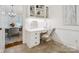 A cozy office space with built in white cabinetry, granite counters and modern chair at 1140 Iverleigh Trl, Charlotte, NC 28270