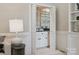 Charming wet bar area with mirrored backdrop, white cabinetry, and elegant lighting at 1140 Iverleigh Trl, Charlotte, NC 28270