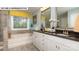 Bathroom showcasing a double vanity, soaking tub, and serene aesthetic at 135 Asmodean Ln, Troutman, NC 28166