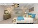 Spacious primary bedroom with a tray ceiling, ceiling fan, and a cozy feel at 135 Asmodean Ln, Troutman, NC 28166