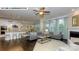 Spacious living room open to kitchen, dining area, featuring a fireplace and comfortable seating arrangements at 135 Asmodean Ln, Troutman, NC 28166