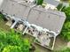 The aerial view showcases a community of homes, each with a private, fenced backyard at 13909 Singleleaf Ln, Charlotte, NC 28278