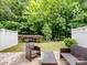 A charming outdoor patio and a well-manicured backyard offer a private retreat at 13909 Singleleaf Ln, Charlotte, NC 28278