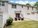A private back patio and grassy yard offer a relaxing outdoor living space at 13909 Singleleaf Ln, Charlotte, NC 28278