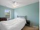 Bedroom with a window and a black bed frame at 13909 Singleleaf Ln, Charlotte, NC 28278