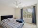 Bedroom with a ceiling fan and a window at 13909 Singleleaf Ln, Charlotte, NC 28278