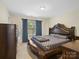 The main bedroom features a large bed and a dresser at 13909 Singleleaf Ln, Charlotte, NC 28278