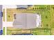Aerial view showcases a home's backyard and patio with outdoor living space, complemented by manicured lawn and landscaping at 1391 Links Crossing Dr, Monroe, NC 28112