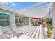 Inviting back patio with stylish pergola, lounge seating, dining area, and decorative plants, creating an outdoor living space at 1391 Links Crossing Dr, Monroe, NC 28112