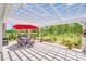 Charming back patio features a dining set, grill, and well-manicured landscaping, perfect for outdoor gatherings and relaxation at 1391 Links Crossing Dr, Monroe, NC 28112
