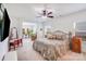 Spacious bedroom with ceiling fan, adjacent sitting area, and an abundance of natural light at 1391 Links Crossing Dr, Monroe, NC 28112