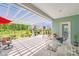 Spacious covered patio area featuring a pergola, dining set, and comfortable lounge seating, ideal for outdoor relaxation at 1391 Links Crossing Dr, Monroe, NC 28112
