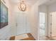 Bright foyer with hardwood floors, chandelier, and decorative wall trim at 1391 Links Crossing Dr, Monroe, NC 28112
