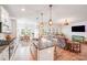 Stylish open-concept kitchen and living space, with an eat-in island and lots of natural light at 1391 Links Crossing Dr, Monroe, NC 28112