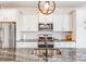 Modern kitchen featuring granite countertops, stainless steel appliances, and pendant lighting over the island at 1391 Links Crossing Dr, Monroe, NC 28112