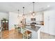 Modern kitchen featuring granite countertops, stainless steel appliances, and pendant lighting over the island at 1391 Links Crossing Dr, Monroe, NC 28112