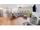 Open-concept living room with modern furniture and view to kitchen at 1391 Links Crossing Dr, Monroe, NC 28112