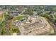 Aerial view of ongoing construction in a community with several completed homes and green spaces at 1479 Hubert Graham Way, Tega Cay, SC 29708