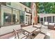 Inviting back deck with seating and dining areas adjacent to the sunroom at 1545 Chadmore Nw Ln, Concord, NC 28027