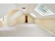 Bright bonus room with carpet, neutral walls, skylight, and an entrance doorway at 1545 Chadmore Nw Ln, Concord, NC 28027