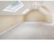 Expansive bonus room boasts vaulted ceilings and skylights for plenty of natural light at 1545 Chadmore Nw Ln, Concord, NC 28027
