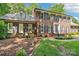 Well-maintained brick home with blue shutters, green grass, and mature landscaping at 1545 Chadmore Nw Ln, Concord, NC 28027