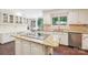 Bright kitchen featuring stainless steel appliances, granite countertops and breakfast bar at 1545 Chadmore Nw Ln, Concord, NC 28027