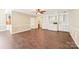 Spacious room with hardwood floors, built-in cabinets, a fireplace, and neutral paint at 1545 Chadmore Nw Ln, Concord, NC 28027