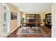 Home office with a large wooden desk and built-in shelving at 1545 Chadmore Nw Ln, Concord, NC 28027