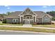 Exterior view of the clubhouse with large windows and stone accents at 18126 Sulton Ter, Huntersville, NC 28078
