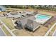 Aerial view of the community clubhouse, pool, playground, and parking area at 18126 Sulton Ter, Huntersville, NC 28078