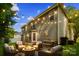 Inviting backyard patio area with a fire pit, seating, and string lights, perfect for outdoor relaxation and entertaining at 19010 Oakhurst Blvd, Cornelius, NC 28031