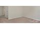 Bedroom featuring soft carpeting, neutral walls, and natural light at 19010 Oakhurst Blvd, Cornelius, NC 28031