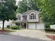 Charming two-story home with a well-manicured front yard, two-car garage, and beautiful architectural detailing at 19010 Oakhurst Blvd, Cornelius, NC 28031