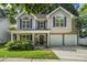 Charming two-story home with a well-manicured lawn, two-car garage, and inviting front porch at 19010 Oakhurst Blvd, Cornelius, NC 28031