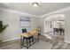 Cozy office space with desk, stylish chair, and view to dining room at 19010 Oakhurst Blvd, Cornelius, NC 28031