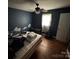 Bedroom with a bed, hardwood floors, window, and door at 2116 Dana Pl, Shelby, NC 28152
