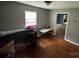 A modest bedroom offers comfort with hardwood floors and a window that lets in natural light at 2116 Dana Pl, Shelby, NC 28152