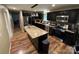 A well-equipped kitchen featuring dark cabinets, granite countertops, and stainless steel appliances at 2116 Dana Pl, Shelby, NC 28152