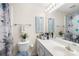 Cozy bathroom featuring a modern vanity, patterned shower curtain, and plant decor at 2490 Hawk Ridge Dr, Gastonia, NC 28056