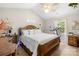 Relaxing bedroom with a vaulted ceiling, plush bedding, and exercise equipment at 2490 Hawk Ridge Dr, Gastonia, NC 28056